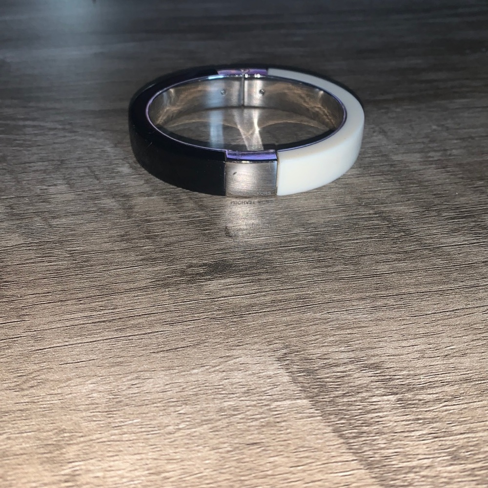 Black and white Michael Kors magnetic bangle